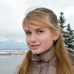 girl in gray jacket smiling
