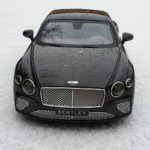 black mercedes benz c class on snow covered ground