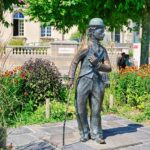 A statue of a man holding a cane